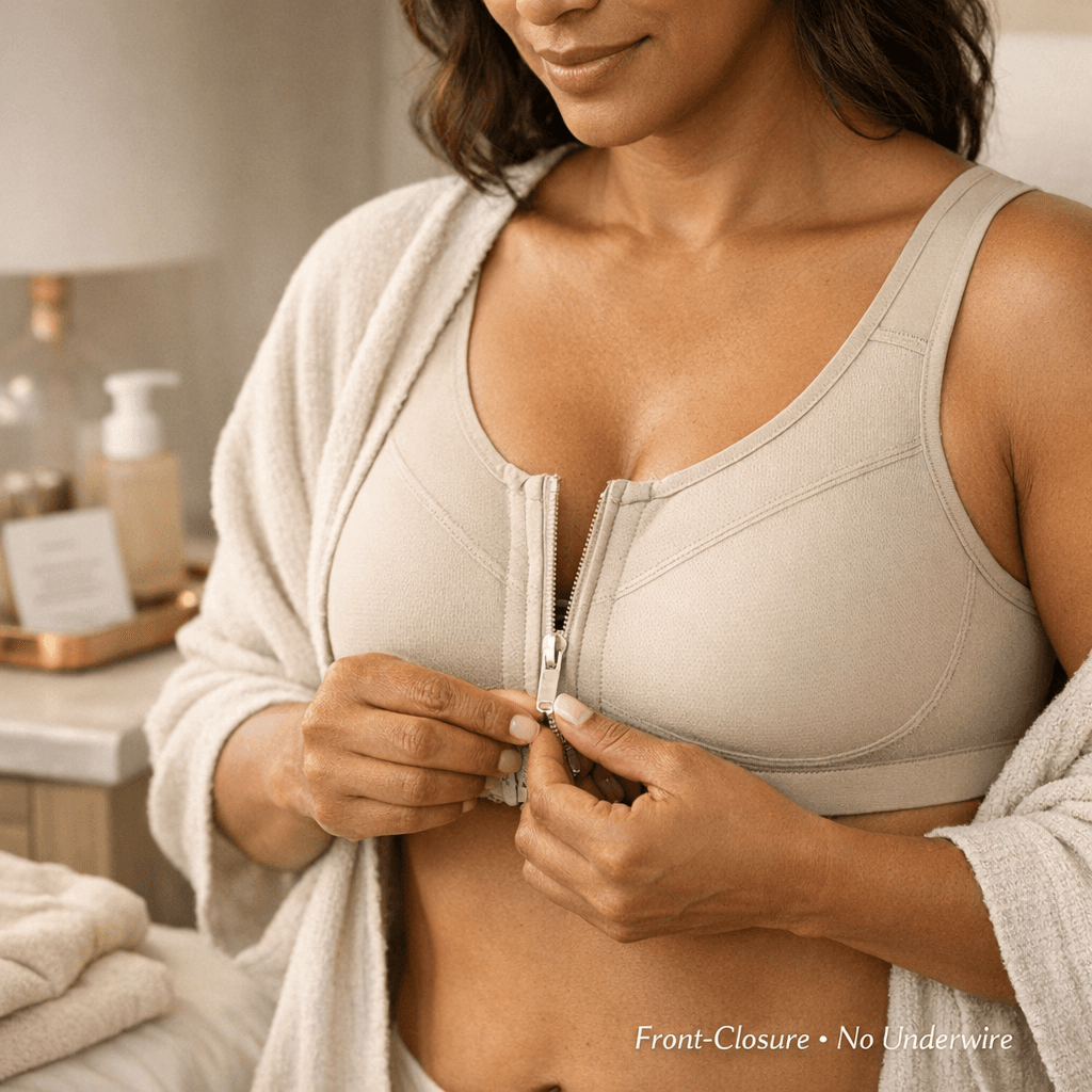 High-end, stone-toned flatlay or on-body (non-explicit) shot of a front-closure post-surgical bra with gentle compression; clean clinic/home setting.